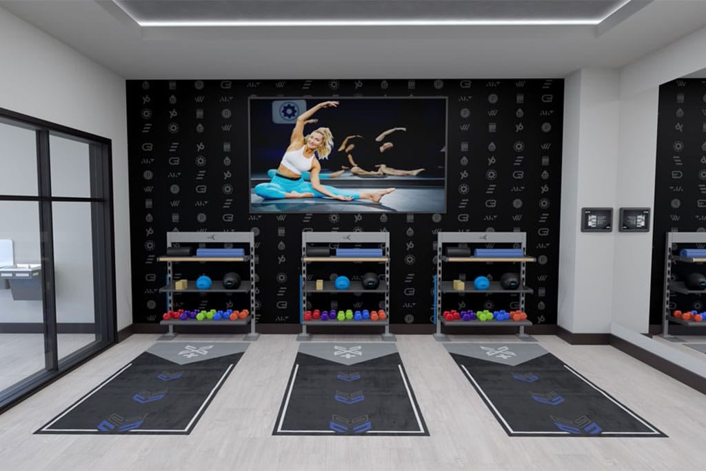 xplus-functional-training-equipment-apartment-gym Xponential+ Functional Fitness on gym TV in amenity room with two Gym Rax storage bays and 3 mats.